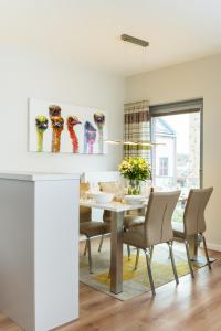 a dining room with a table and chairs at Ostsee - Appartement Nr 89 "Salzaster" im Strand Resort in Heiligenhafen