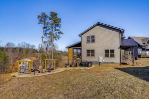 a home with a playground and a house at Hot Tub, Fireplace and Views Sevierville Retreat! in Sevierville