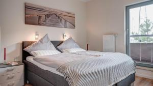Ein Bett oder Betten in einem Zimmer der Unterkunft Ostsee - Appartement Nr 181 "Uferschwalbe" im Strand Resort