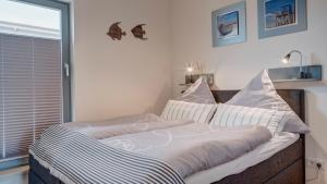 Ein Bett oder Betten in einem Zimmer der Unterkunft Ostsee - Appartement Nr 181 "Uferschwalbe" im Strand Resort
