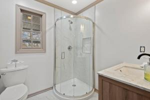 a bathroom with a shower and a toilet and a sink at Jarrett Farm Resort - Suite 11 in Ramona