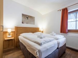 Posteľ alebo postele v izbe v ubytovaní Alpensteinbock Saalbach