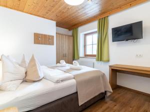 Posteľ alebo postele v izbe v ubytovaní Alpensteinbock Saalbach