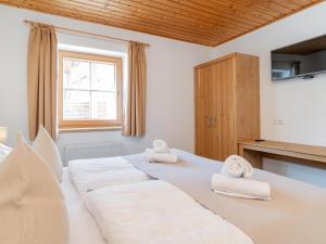 Posteľ alebo postele v izbe v ubytovaní Alpensteinbock Saalbach
