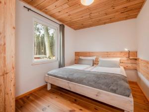 Postel nebo postele na pokoji v ubytování Dünenblick 2
