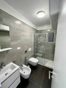 a bathroom with a sink and a toilet and a shower at Apartments by the sea Nerezine, Losinj - 23786 in Nerezine