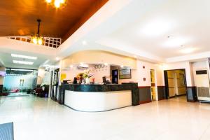 a lobby of a hotel with a reception counter at Hotel Sogo Santa Mesa in Manila