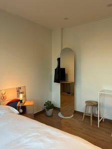 Postel nebo postele na pokoji v ubytování Botanik Hotel Cheonan