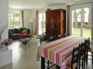 a living room with a table with a colorful blanket on it at Holiday Home in Carnac near Sandy Beach in Carnac