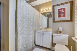 a bathroom with a toilet and a sink at 50 Lincoln Short North Bed & Breakfast in Columbus +62 photos