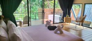Postel nebo postele na pokoji v ubytování Hom I Din Farm and Homestay