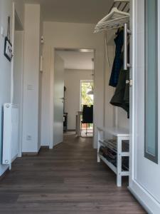 a hallway with a door leading into a room at Ferienhaus Ruheoase im Müritz Seepark in Röbel