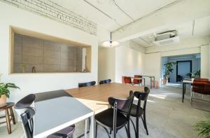 a large room with a table and chairs in it at Botanik Hotel Cheonan in Cheonan