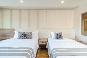 Ein Bett oder Betten in einem Zimmer der Unterkunft Phuket Graceland Resort and Spa