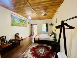 a bedroom with a bed and a living room at Ali Garden Homestay Tràng An Ninh Bình in Xuân Sơn +74 photos