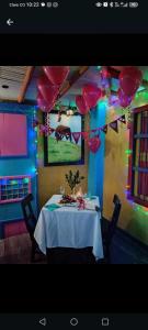 a dining room with a table with balloons on it at DESCANSO DEL ARRIERO - Su Mejor Descanso en Guatapé in Guatapé +26 photos