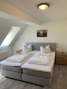 Ένα ή περισσότερα κρεβάτια σε δωμάτιο στο Ferienhaus Eibe am Jabeler See 7a