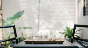 a table with two glasses on top of it at Lloyd's Inn in Singapore