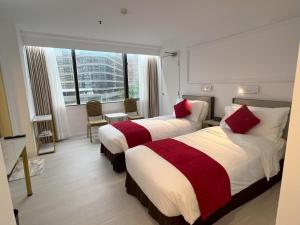 En eller flere senger på et rom på Best Western Plus Tsim Sha Tsui