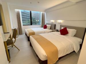 En eller flere senger på et rom på Best Western Plus Tsim Sha Tsui