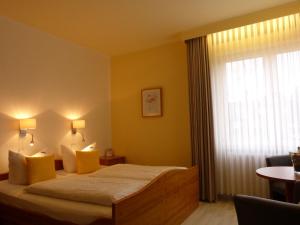 Postel nebo postele na pokoji v ubytování Hotel Brandaris