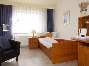 Postel nebo postele na pokoji v ubytování Hotel Brandaris