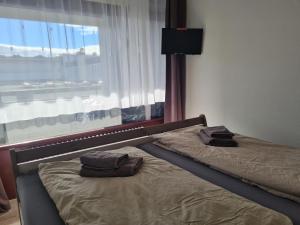 Una cama o camas en una habitación de Die kleine Freiheit Grömitz Center - Unmittelbare Strandlage mit allem Komfort