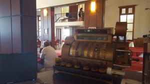 a man sitting in a room with a pile of equipment at Montecassino in Capilla del Monte