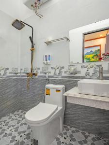 a bathroom with a toilet and a sink at Hang Mua Holiday Homestay - Trang An in Ninh Binh +27 photos