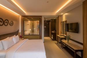 En eller flere senge i et værelse på Le Bali Resort & Spa