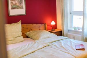 Postel nebo postele na pokoji v ubytování Ostseeresidenz - Whg 16 + 5 fotografií