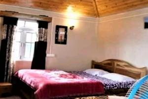 Postel nebo postele na pokoji v ubytování StayApart - Chiabari Homestay