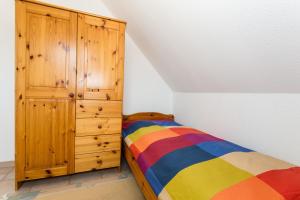 Postel nebo postele na pokoji v ubytování Deichweg 12 + 4 fotografie