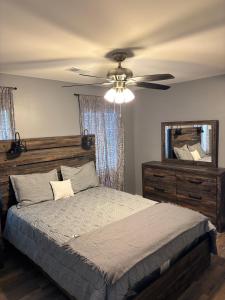 a bedroom with a bed and a ceiling fan at CeloVacationHousing in Memphis