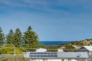 a view of a house with the ocean in the background at 66 Neighbour Ave Goolwa - Linen Provided in Goolwa South
