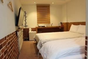 Giường trong phòng chung tại Hotel Biz Jongno Insadong