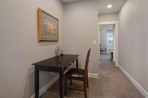 a room with a table and a chair with a telephone at Five Peaks in Bend