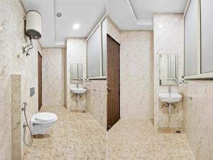 Koupelna v ubytování Treebo Elegant Palace + 37 fotografií