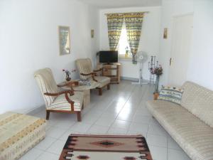 Μια τηλεόραση ή/και κέντρο ψυχαγωγίας στο Ferienhaus Nr 2B +9 φωτογραφίες
