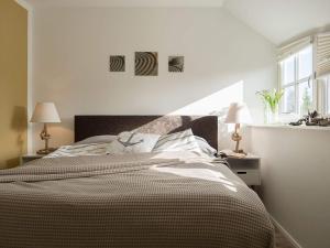 Postel nebo postele na pokoji v ubytování Ferienhaus "Zum Achterknoten"