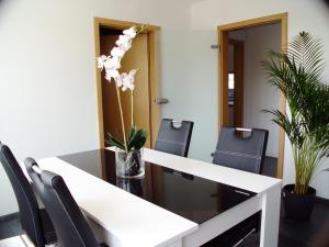 a conference room with a white table and chairs at La Domus Premium in Lotte