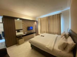 Postelja oz. postelje v sobi nastanitve Hotel 88 Jember By WH - Strategic Location In The City Center
