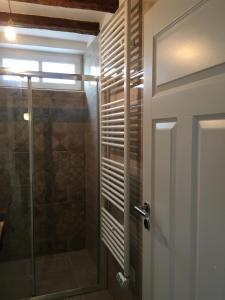 a bathroom with a shower and a glass door at Bellavista Attic Apartment in Izola +50 photos