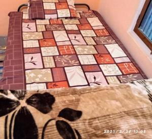a bed with a quilt with a dog laying on it at Swastik HomeStay in Ayodhya