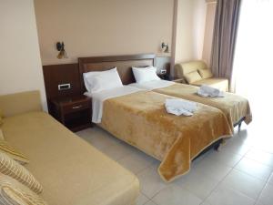 Postel nebo postele na pokoji v ubytování 9 Queens Spa Hotel