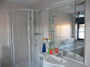 a bathroom with a shower and a sink at unser Ferienhaus in Hempel