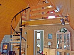 a staircase in a home with wooden ceilings at Ferienhaus Busch in Bünsdorf