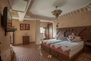 Postel nebo postele na pokoji v ubytování Riad Salam Fes