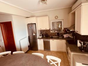 Kuchyň nebo kuchyňský kout v ubytování Dream House Theologos + 3 fotografie