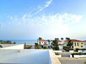 a view of the ocean from a building at Luxury Villa Azure in Larnaca